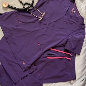 Smitten women’s scrubs. Super cute and stylish! Purple and pink, size XS.